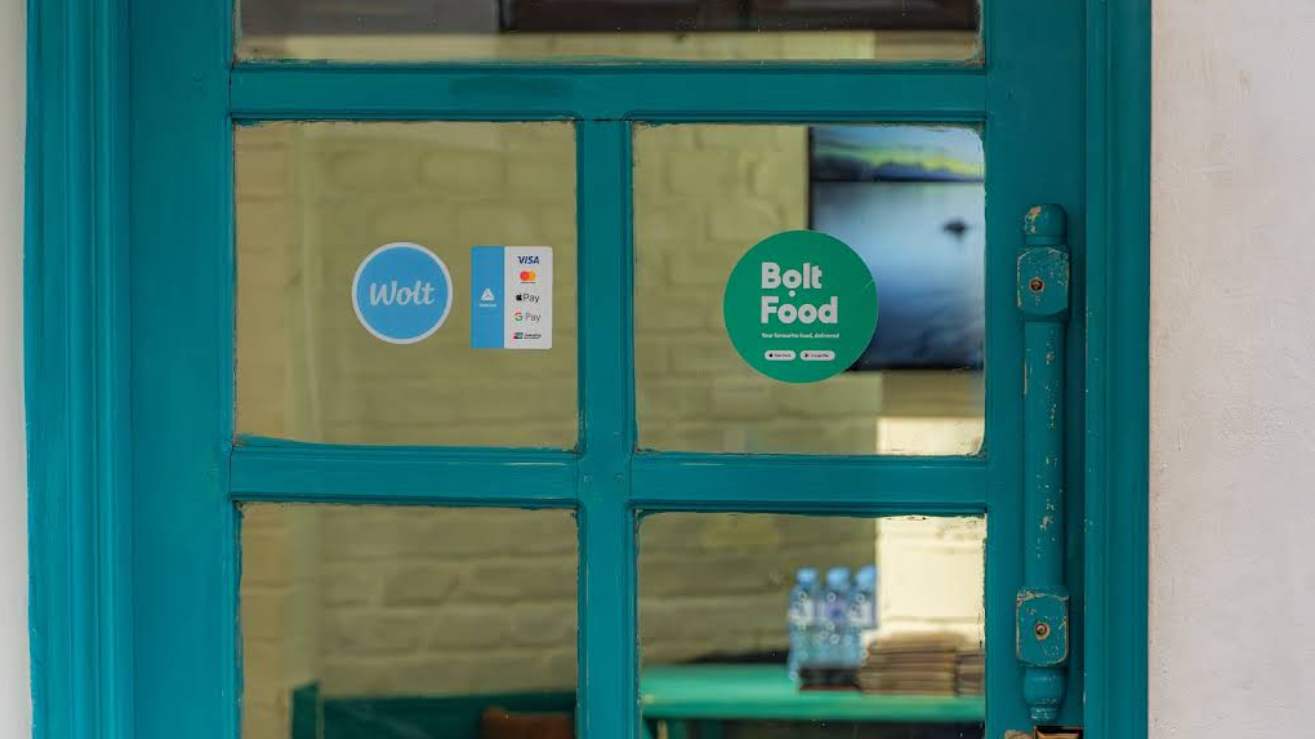 Restaurant Entrance with Payment Options - Modern Indian Restaurant in Tbilisi accepting multiple payment methods including Wolt and Bolt Food