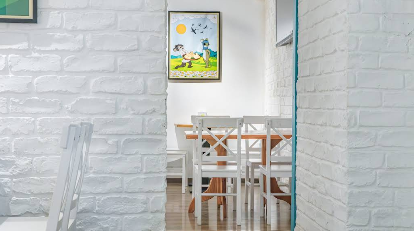 Interior Seating Area - Comfortable family dining at the best Restaurant in Tbilisi with artistic wall decorations