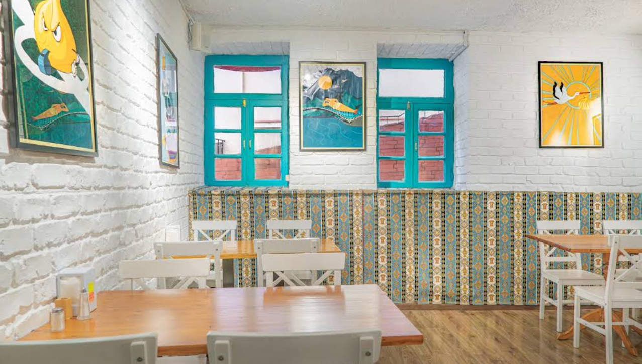 Main Dining Room - Spacious interior at Tajmahal Restaurant Tbilisi featuring traditional tile work and modern amenities